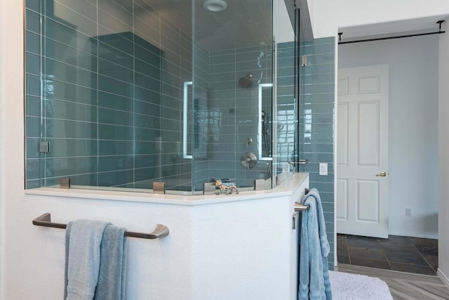 bathroom featuring a tile shower