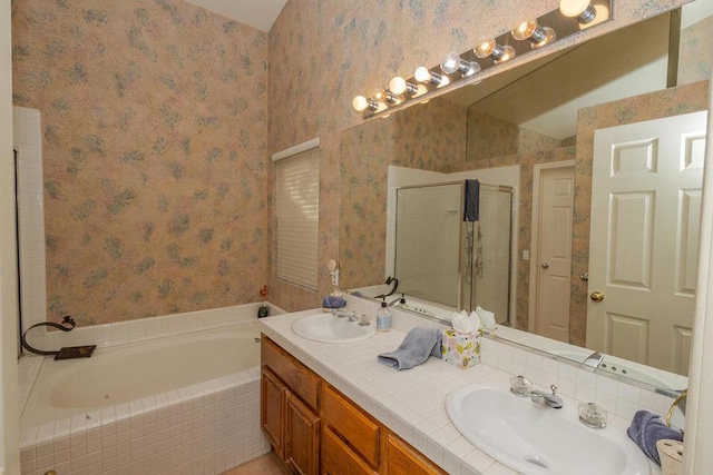 bathroom with independent shower and bath and vanity