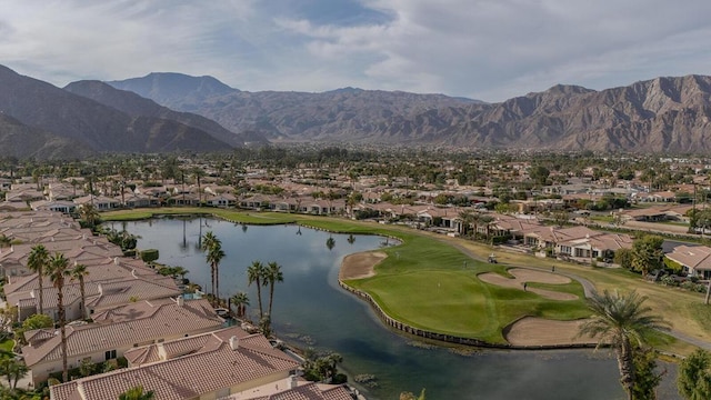 exterior space with a water and mountain view