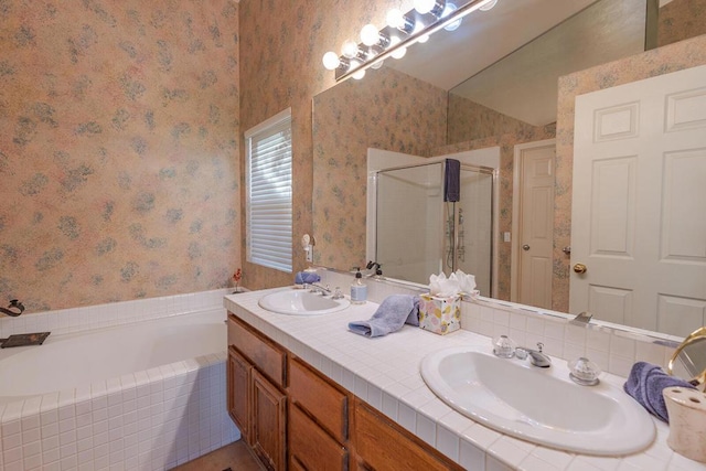 bathroom with vanity and independent shower and bath