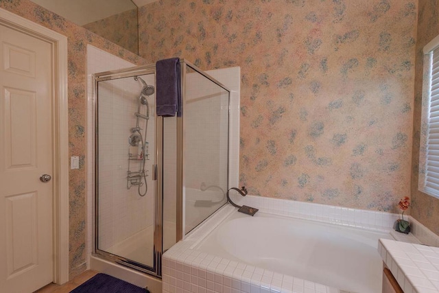 bathroom with vanity and separate shower and tub