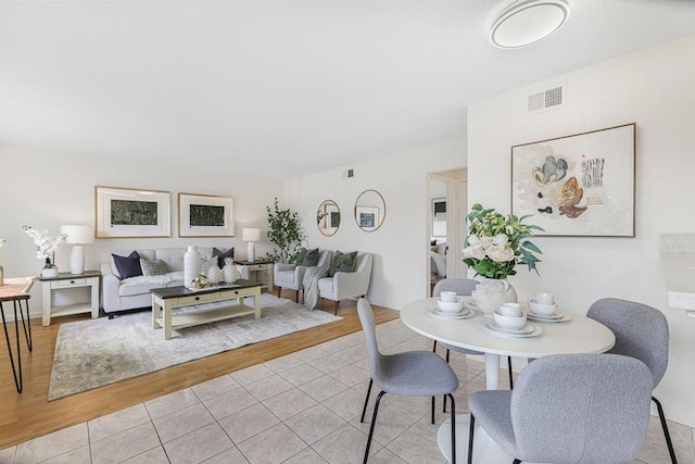 dining space with light tile patterned floors