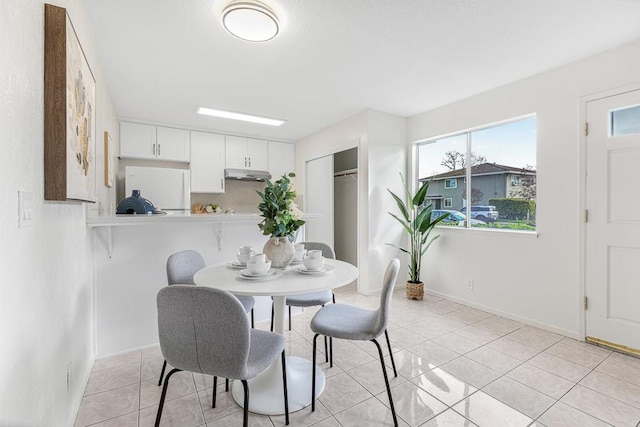 dining area with light tile patterned flooring