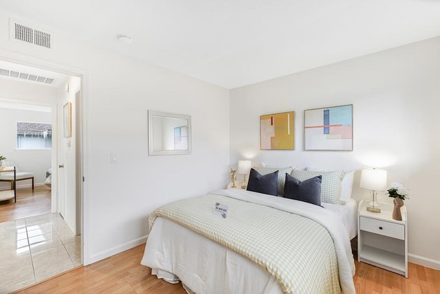 bedroom featuring hardwood / wood-style floors