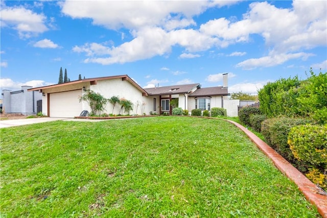 ranch-style house with a garage and a front lawn