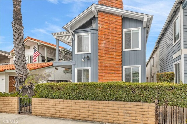 view of side of property with a balcony