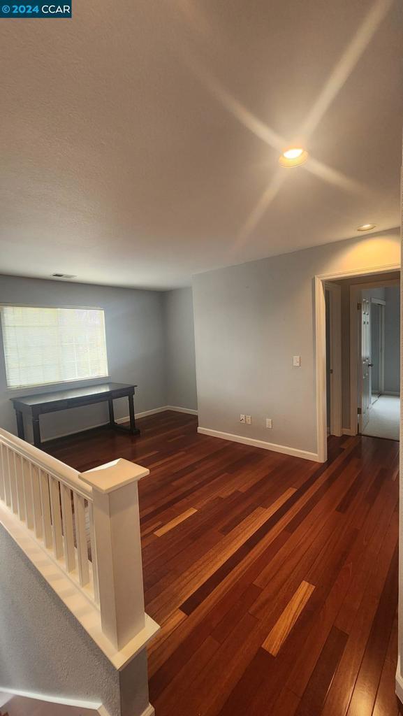 interior space with dark wood-type flooring