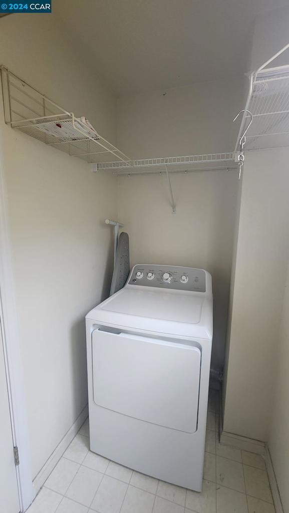 laundry area with washer / dryer