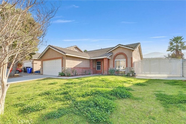 single story home featuring a front lawn and a garage