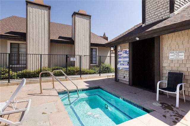 view of swimming pool featuring a patio area