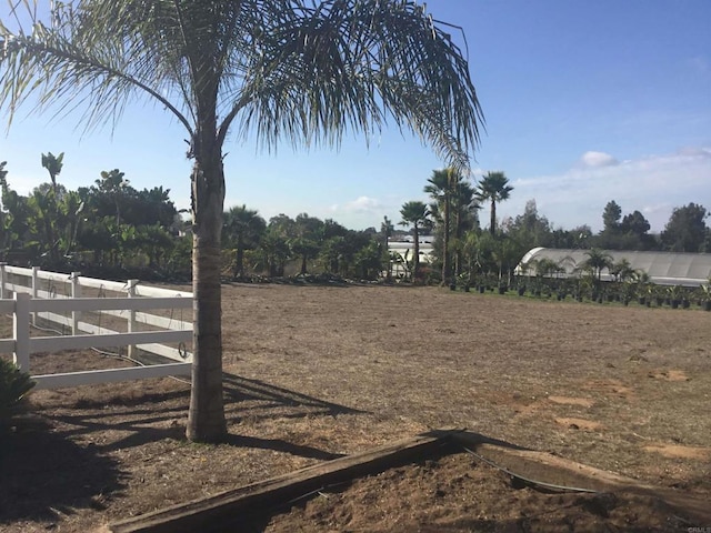 view of yard with a rural view