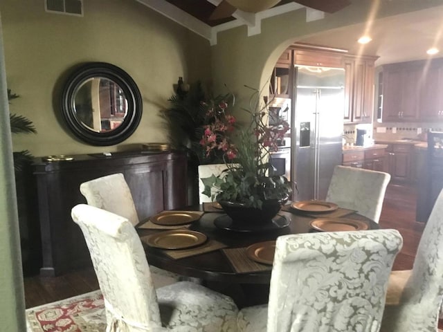 dining space featuring dark wood-type flooring