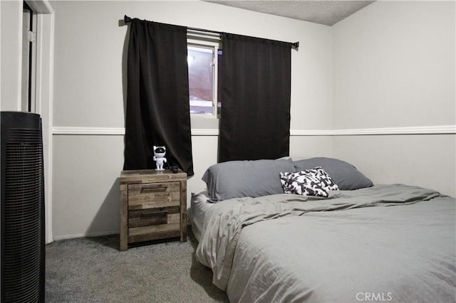 carpeted bedroom with a textured ceiling