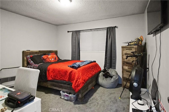 bedroom featuring a textured ceiling and carpet flooring