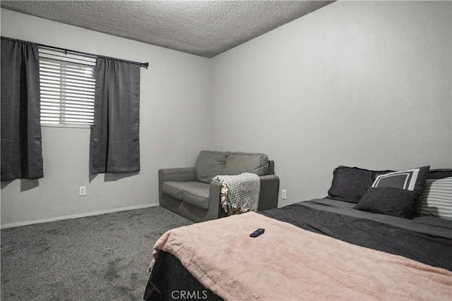 carpeted bedroom featuring a textured ceiling