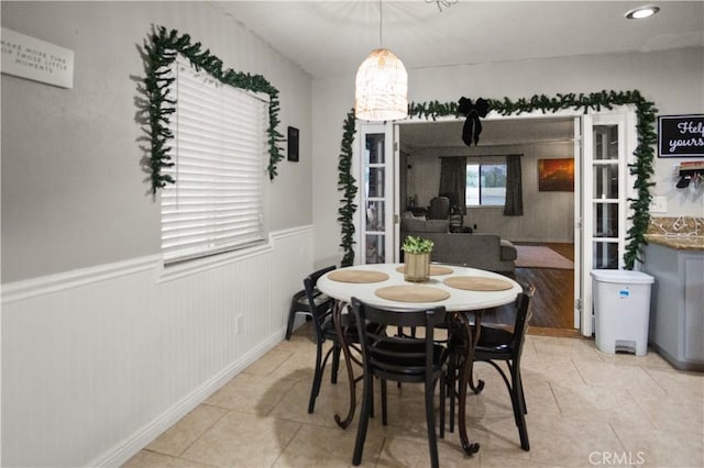 dining area featuring light tile patterned floors