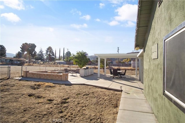 view of yard with a pergola and a patio