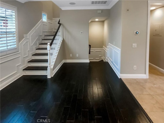 stairway with hardwood / wood-style floors