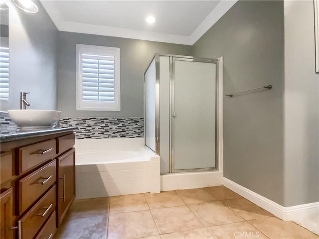 bathroom with vanity, ornamental molding, separate shower and tub, and tile patterned flooring