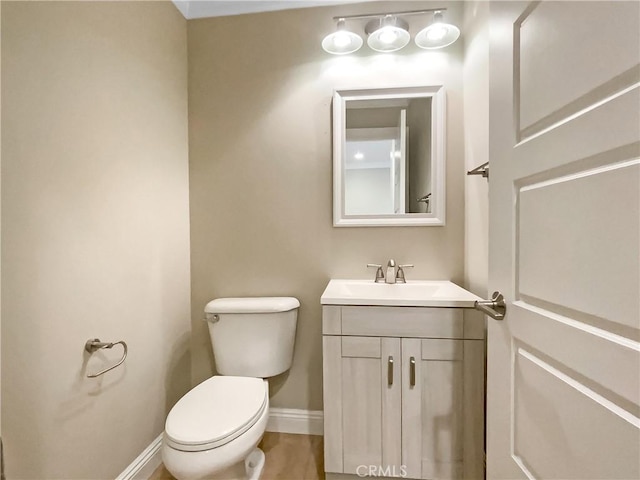 bathroom featuring toilet and vanity