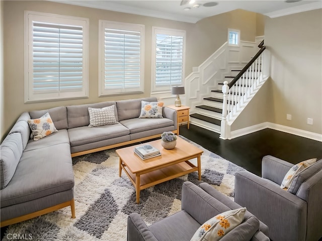 living room with crown molding and hardwood / wood-style floors