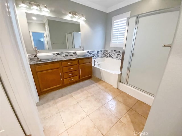 bathroom with a sink, a shower stall, crown molding, tile patterned floors, and a bath