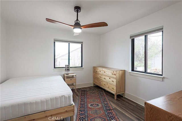 bedroom featuring ceiling fan and dark hardwood / wood-style flooring