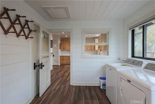 laundry area with wood walls, dark hardwood / wood-style floors, washing machine and clothes dryer, and wooden ceiling