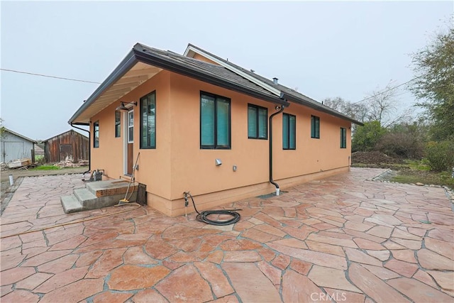 view of home's exterior with a patio area