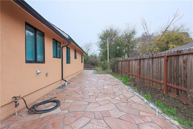 view of property exterior featuring a patio area