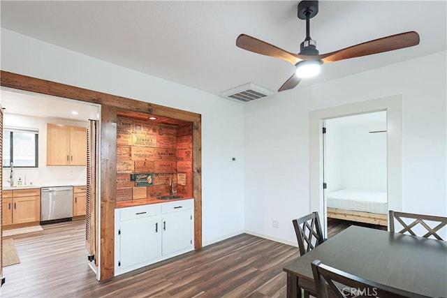 interior space featuring ceiling fan, sink, and hardwood / wood-style floors