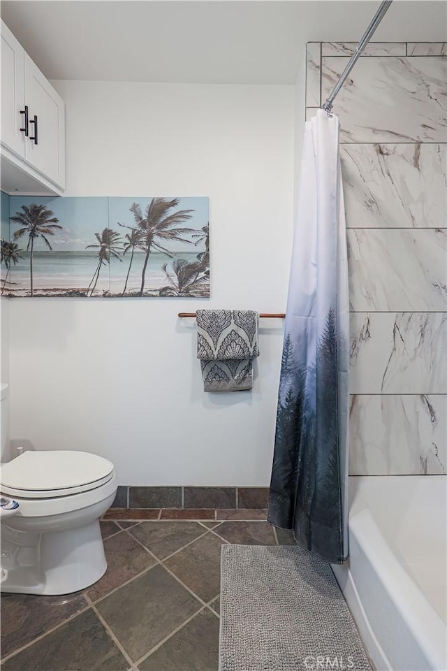 bathroom with toilet and shower / tub combo with curtain