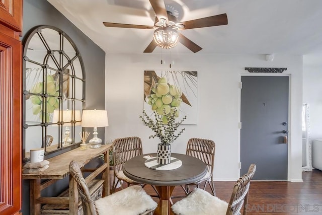 dining room featuring ceiling fan and dark hardwood / wood-style floors