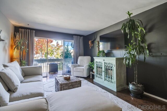 living room featuring dark hardwood / wood-style flooring