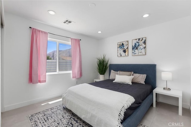 bedroom featuring light tile patterned flooring