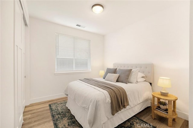 bedroom with light wood-type flooring