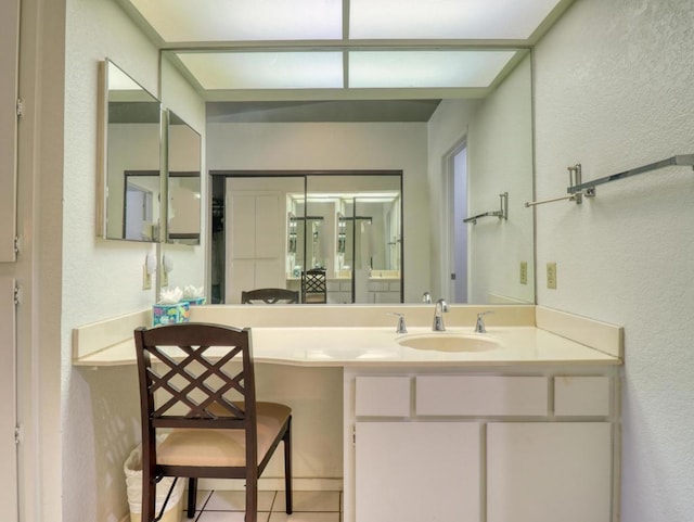 bathroom with vanity and tile patterned flooring