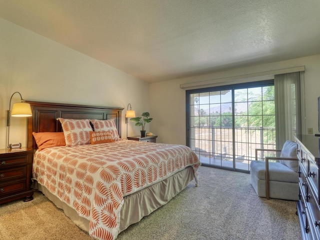 carpeted bedroom featuring access to outside