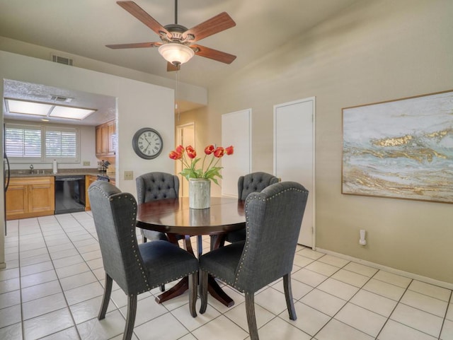 dining room with ceiling fan, light tile patterned flooring, and lofted ceiling