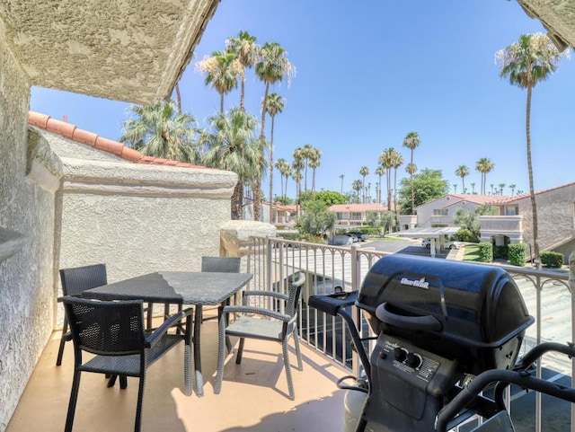 view of patio with a balcony and area for grilling