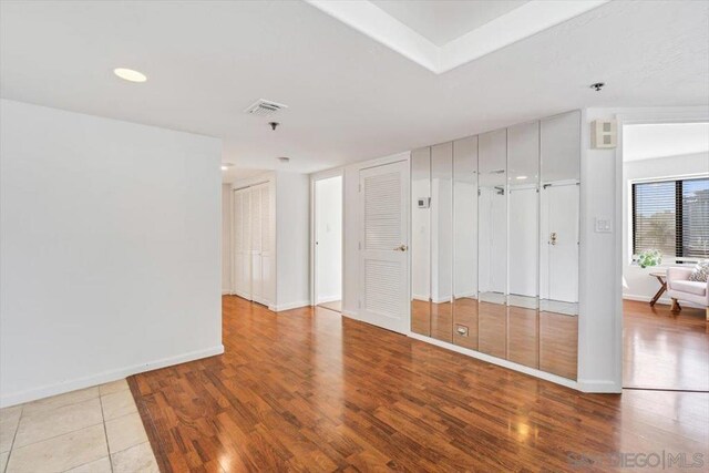 spare room featuring light wood-type flooring