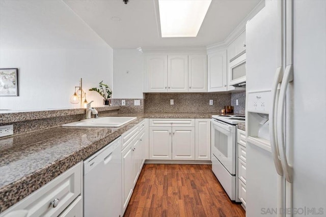 kitchen featuring dark wood-type flooring, white cabinetry, sink, and white appliances