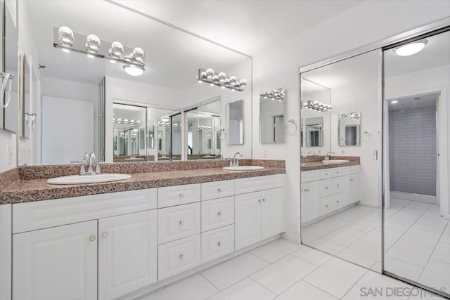 bathroom featuring tile patterned floors and vanity