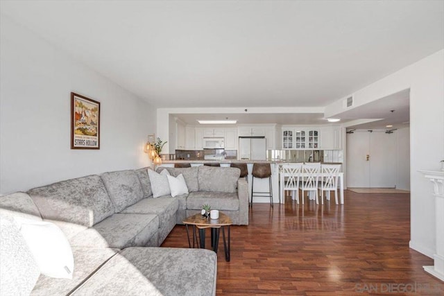 living room featuring dark wood-type flooring