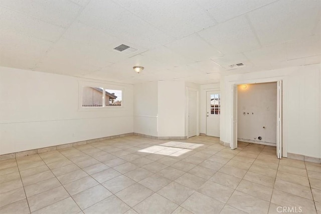 empty room with a paneled ceiling