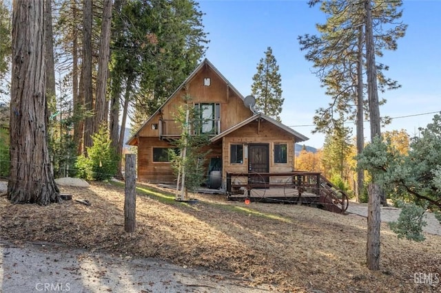 view of front of home featuring a wooden deck