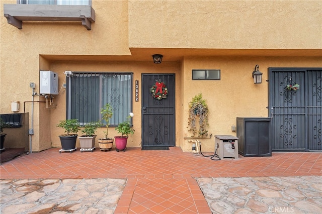 property entrance with a patio