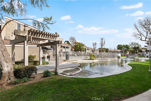 view of yard with a water view and a pergola