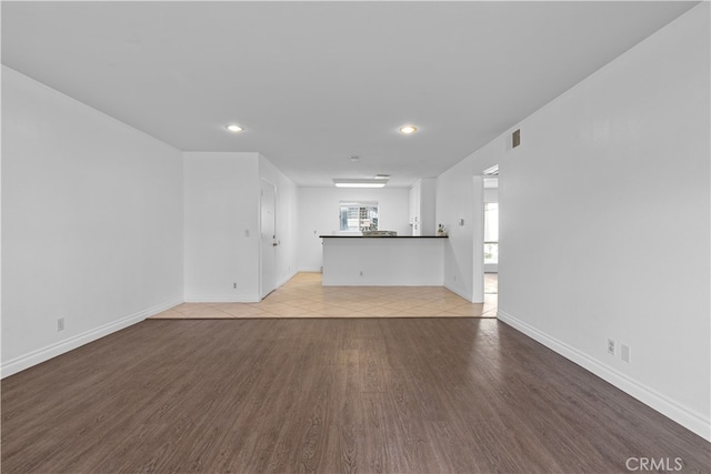 unfurnished living room with light hardwood / wood-style floors