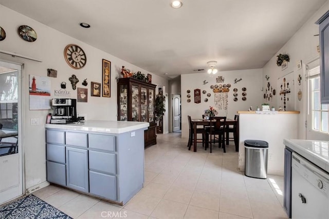 kitchen with kitchen peninsula and light tile patterned flooring